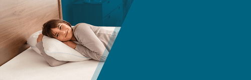 woman resting her head on tempur cloud adjustable pillow with blue gradient