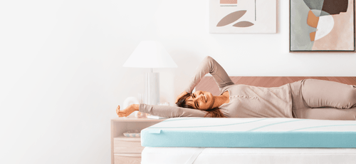 Woman laying on Tempur Adapt plus cooling topper